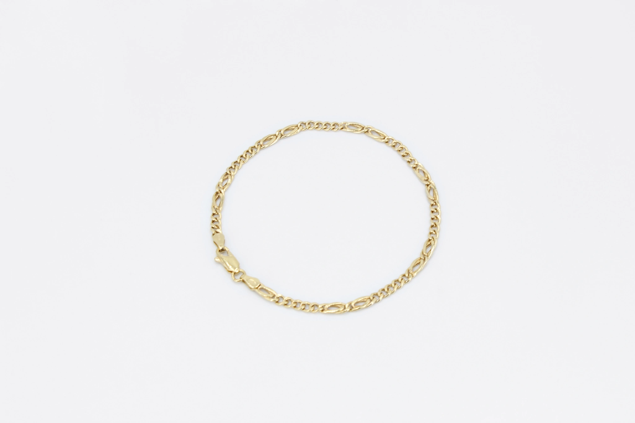 Pulsera Figaro de oro 18K